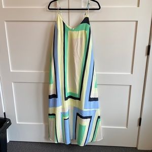 Silk slip dress lined in yellow, blue, green, tan and black.
